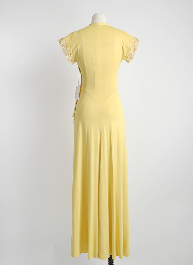 1940s yellow nylon jersey gown with side swag