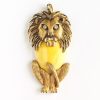 70s brass + yellow lucite lion pendant
